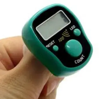 Green compact digital finger counter held in hand