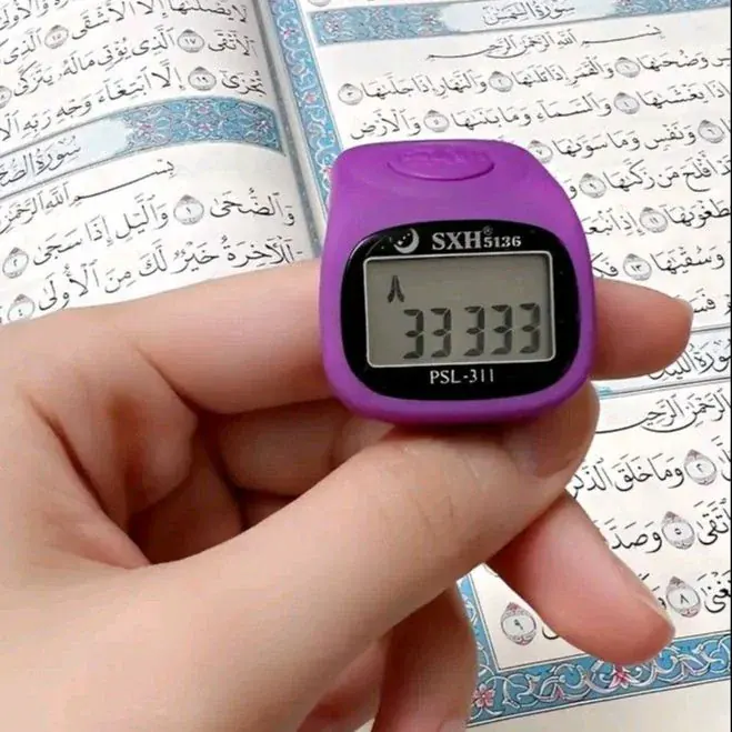Purple digital finger counter used with Quran recitation